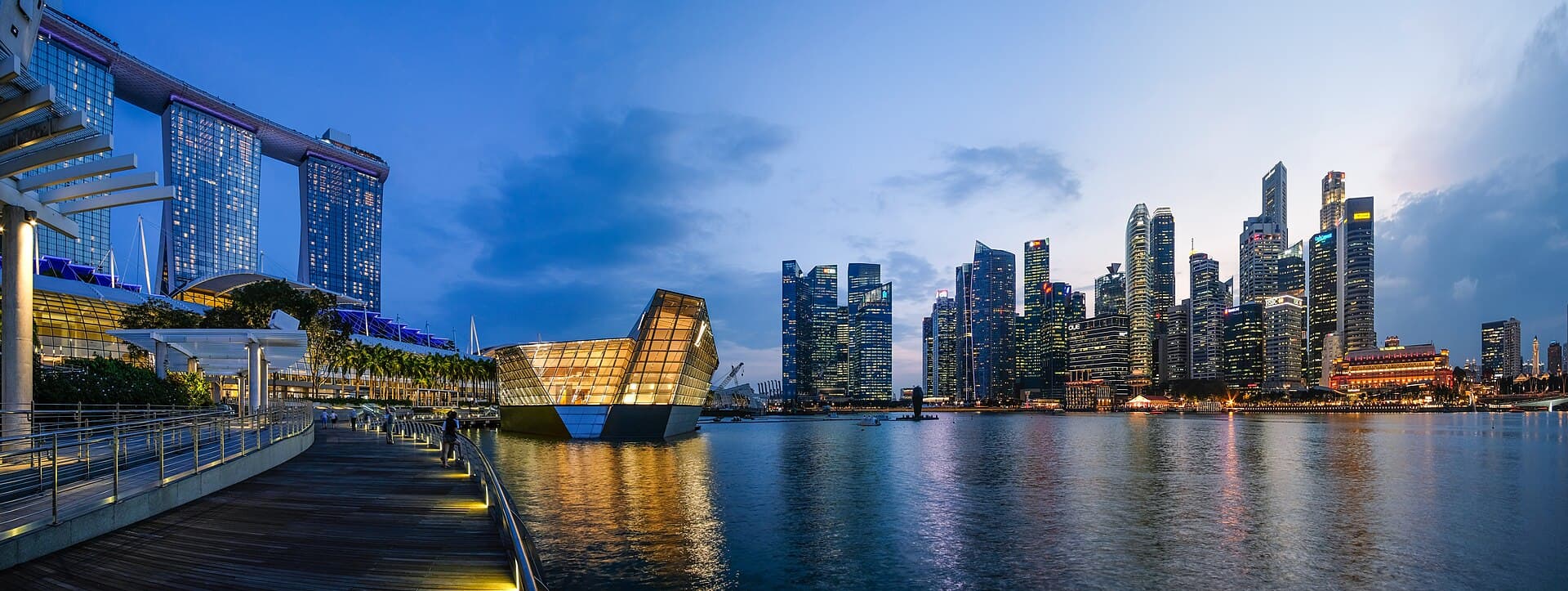 Marina Bay at dusk, with Marina Bay Sands, the ArtScience Museum and the CBD skyline across the water.